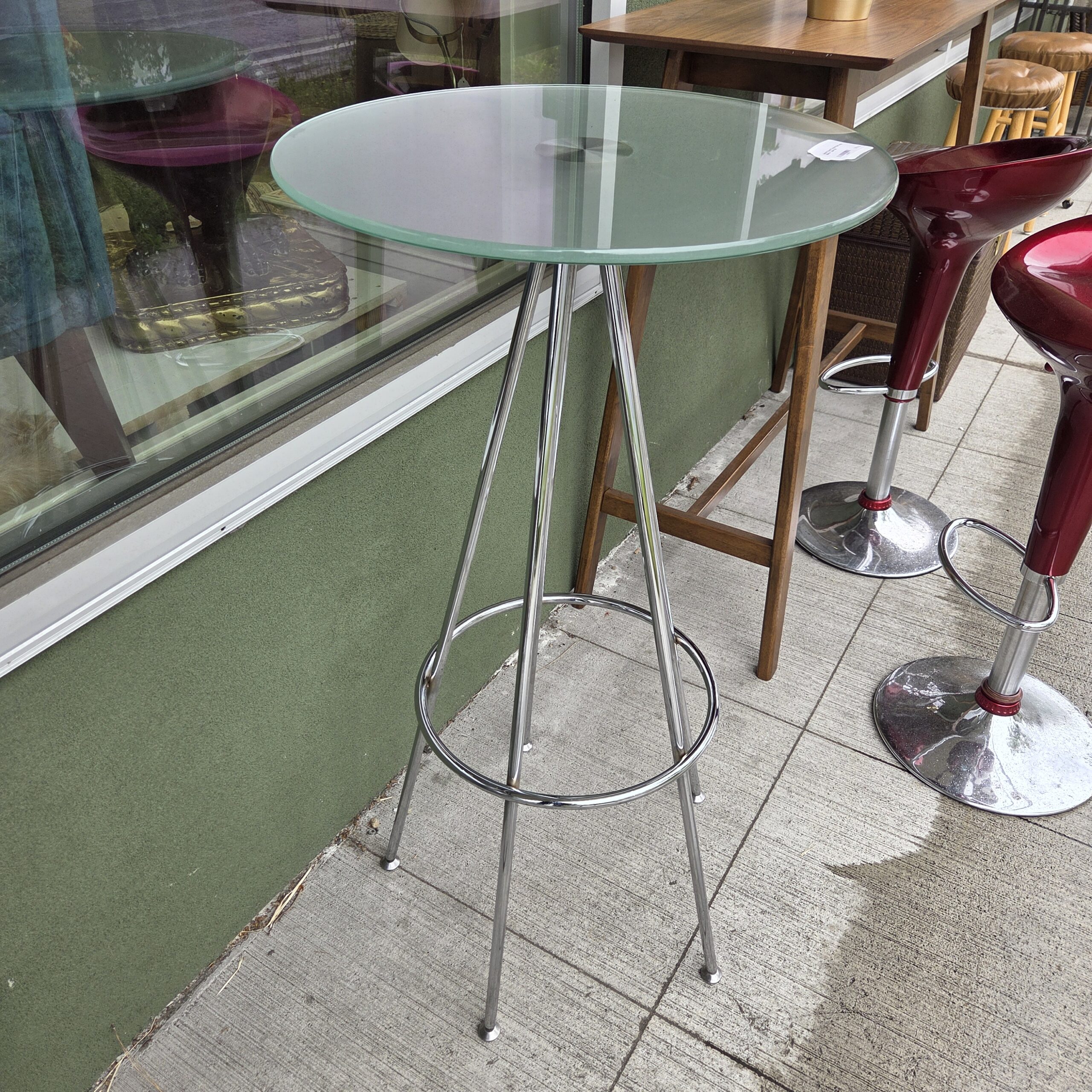 small round chrome bar height bistro table