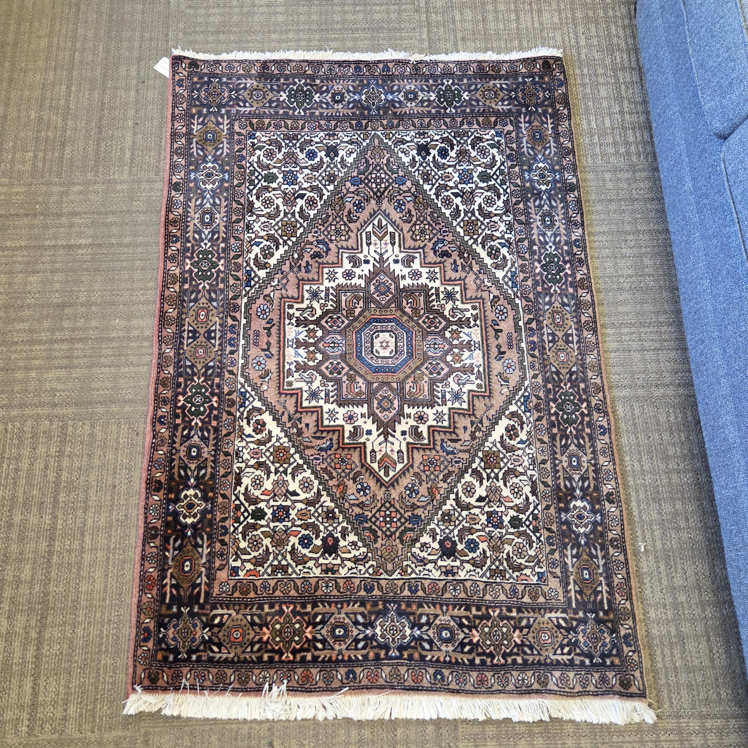 traditional hand knotted tan rug