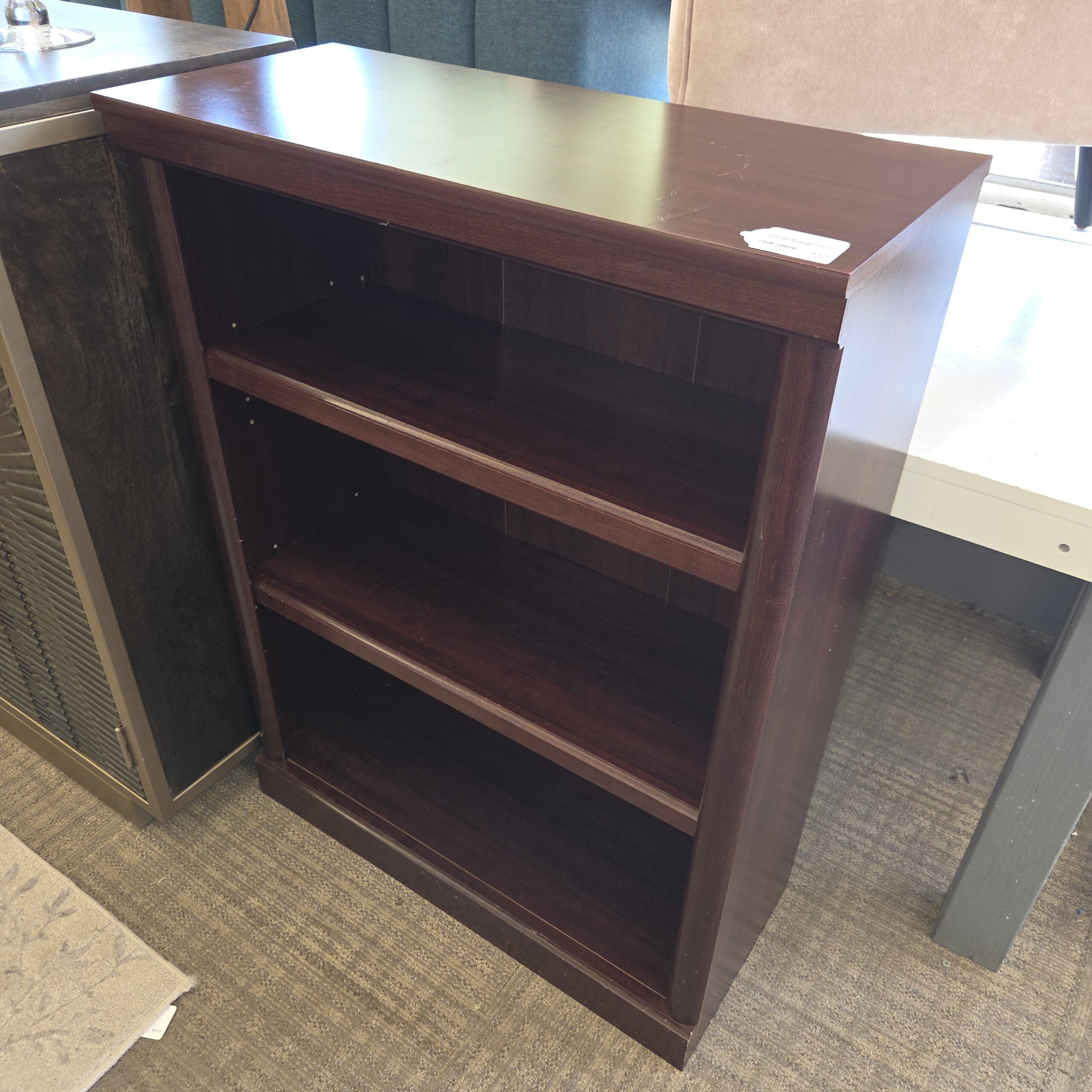 small dark warm laminate top bookcase (as is)