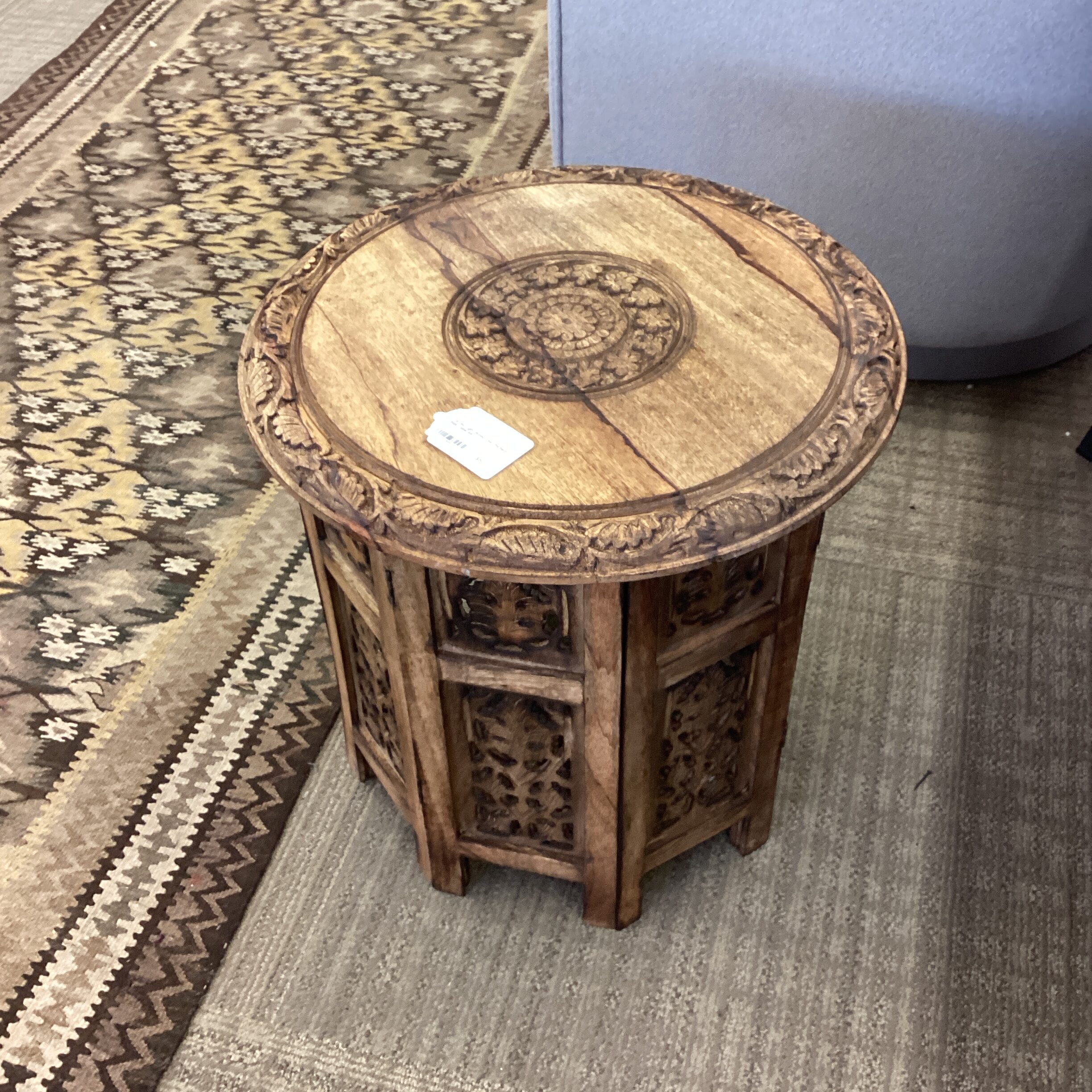 carved light wood leaf pattern side table