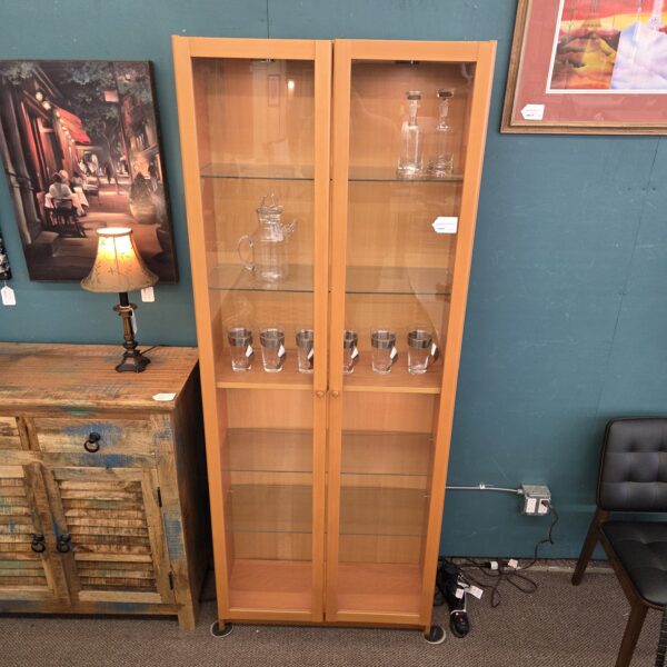 lighted blonde bookcase w/glass doors & shelves