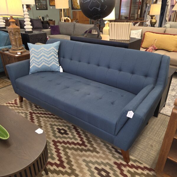dark blue tufted high back sofa