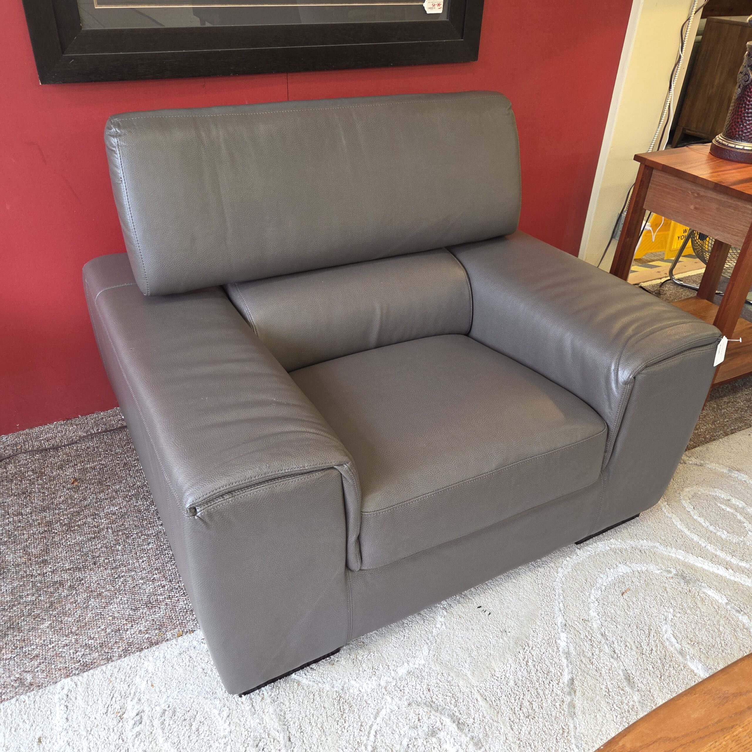 chunky charcoal leatherette armchair (as is)